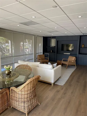 a view of a dining room with furniture and window