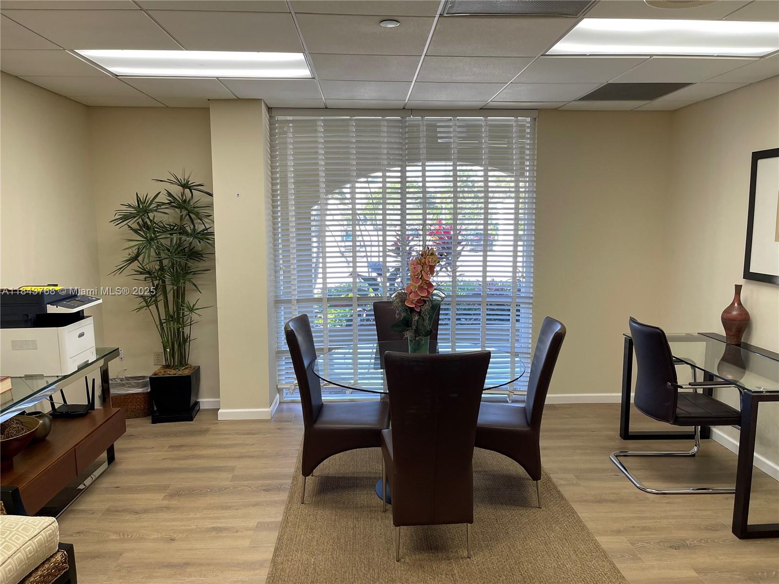2351 Douglas Road, Unit 1208 Miami, FL 33145 - Photo 15 of 18 a view of a dining room with furniture and window
