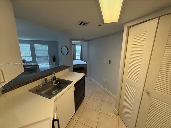 a kitchen with a stove and a refrigerator