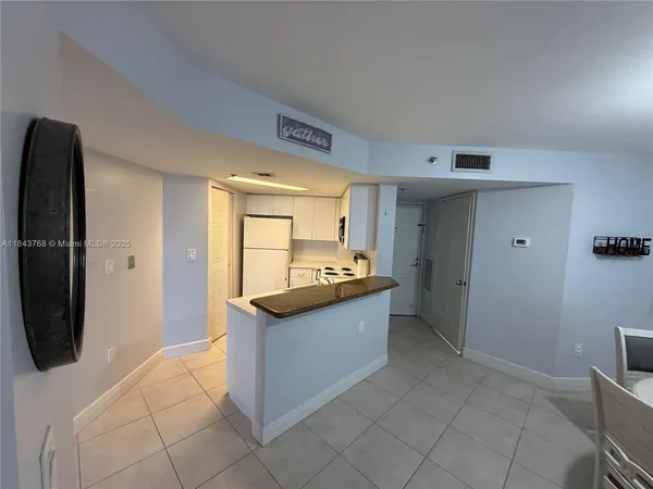 a large bathroom with a tub and a sink