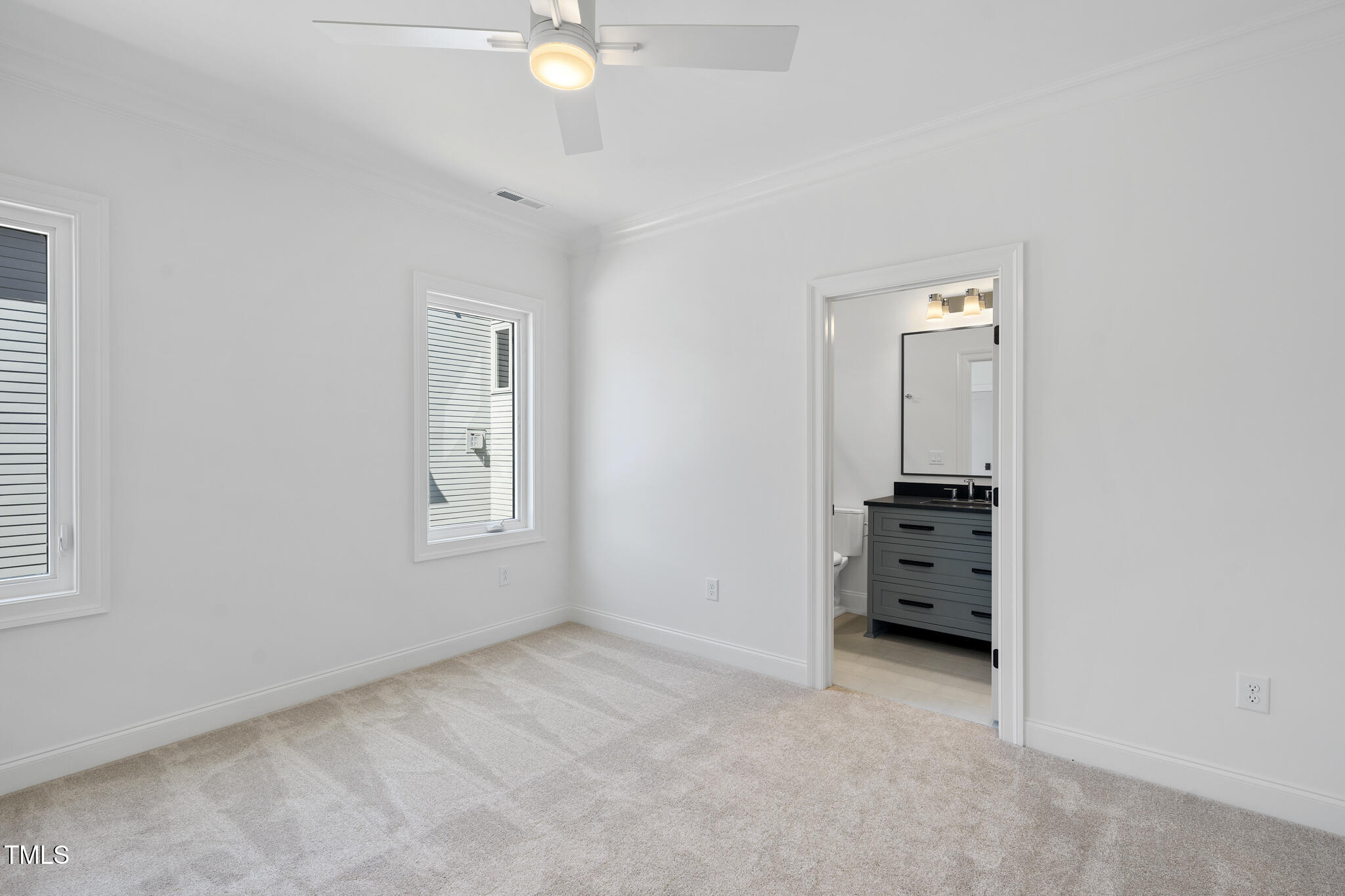 3410 Bradley Place Raleigh, NC 27607 - Photo 29 of 37 an empty room with windows and cabinet