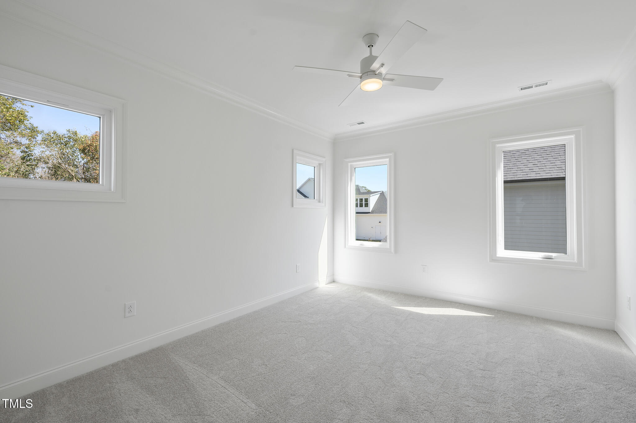 3410 Bradley Place Raleigh, NC 27607 - Photo 31 of 37 an empty room with windows and fan