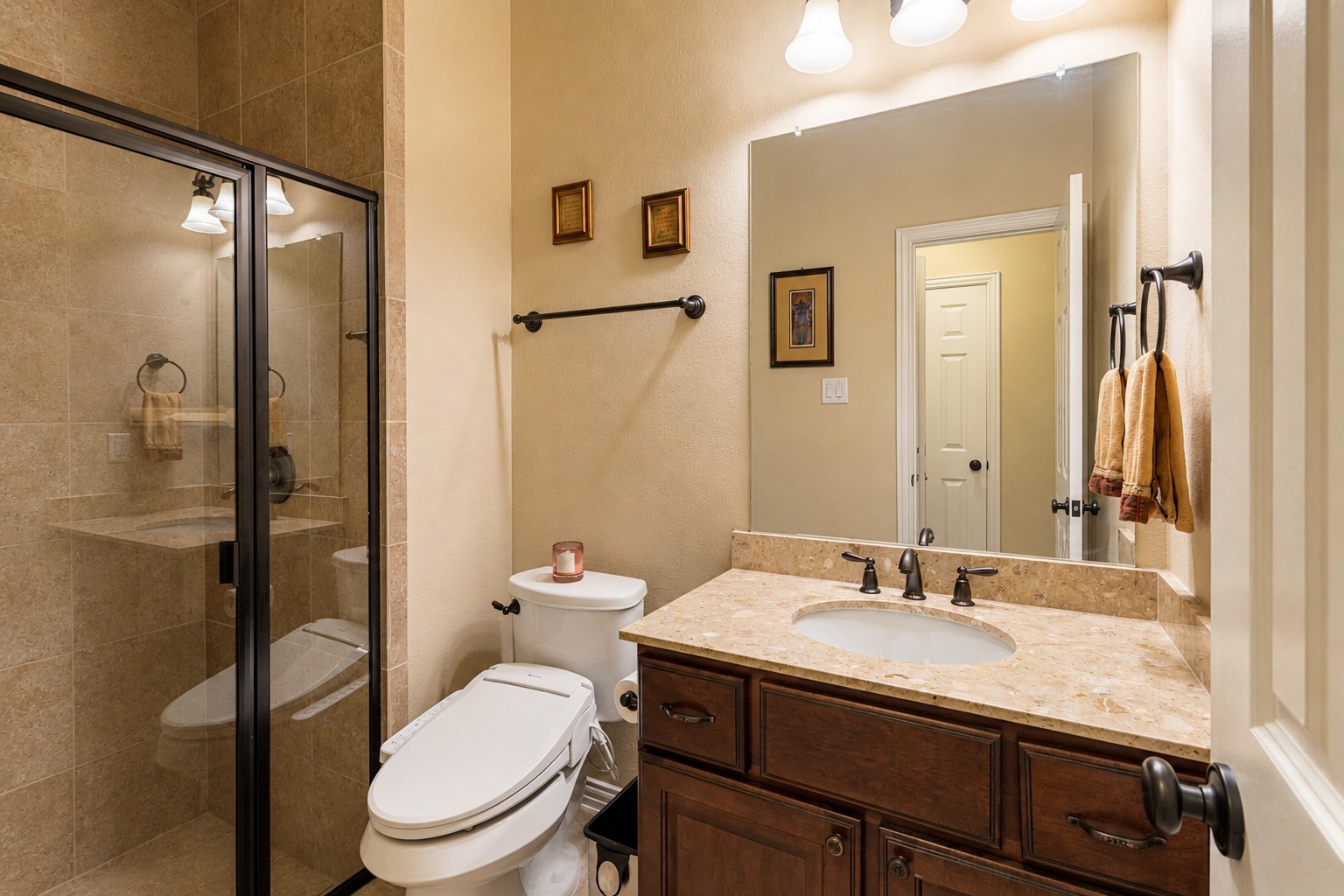 2326 Hamilton Pool Lane Friendswood, TX 77546 - Photo 28 of 49 a bathroom with a sink toilet and shower