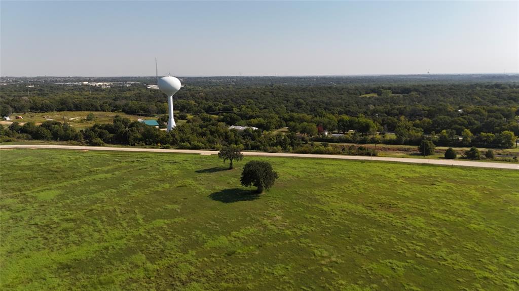a view of a water fountain and a big yard