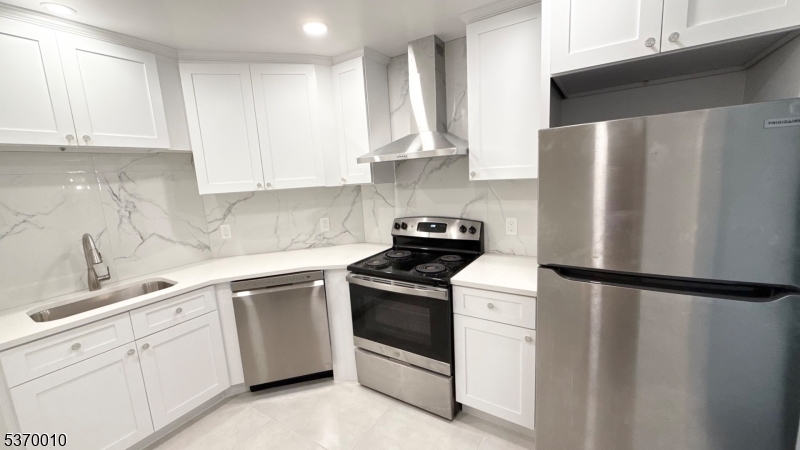 76 Jamestown Road Bernards, NJ 07920 - Photo 1 of 20 a kitchen with white cabinets and white appliances