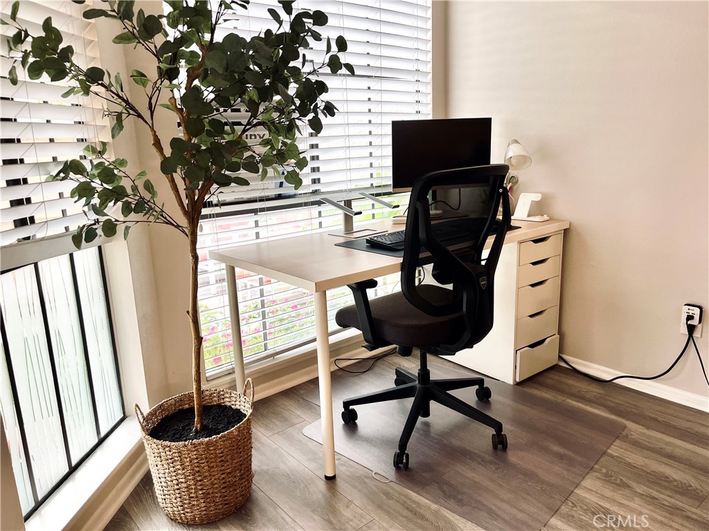 12635 Briarglen Loop, Unit K Stanton, CA 90680 - Photo 4 of 12 a view of a workspace with furniture and a window