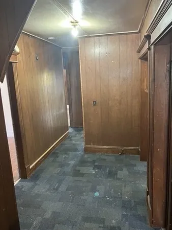 a view of entryway with wooden walls