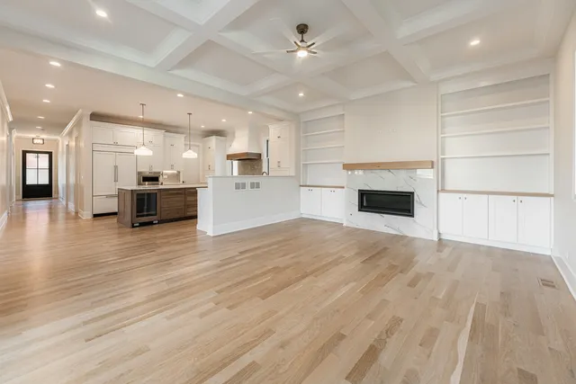 a bathroom with a double vanity sink a mirror and bathtub