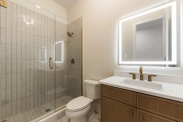 a bathroom with a double vanity sink mirror and