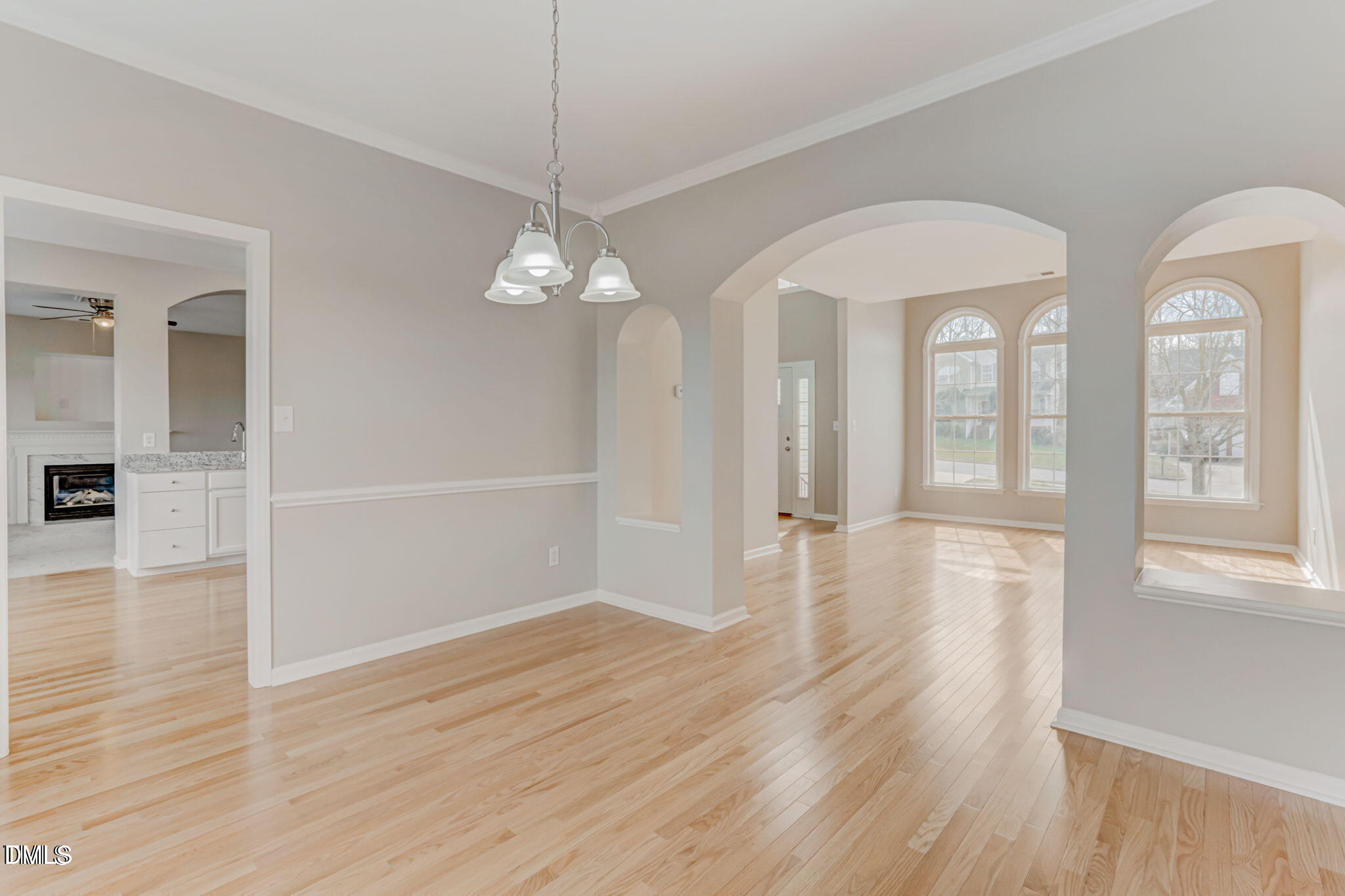 480 Seastone Street Raleigh, NC 27603 - Photo 10 of 26 wooden floor in an empty room with a window