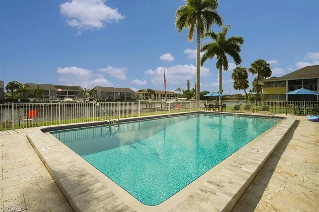a view of a lake with a swimming pool