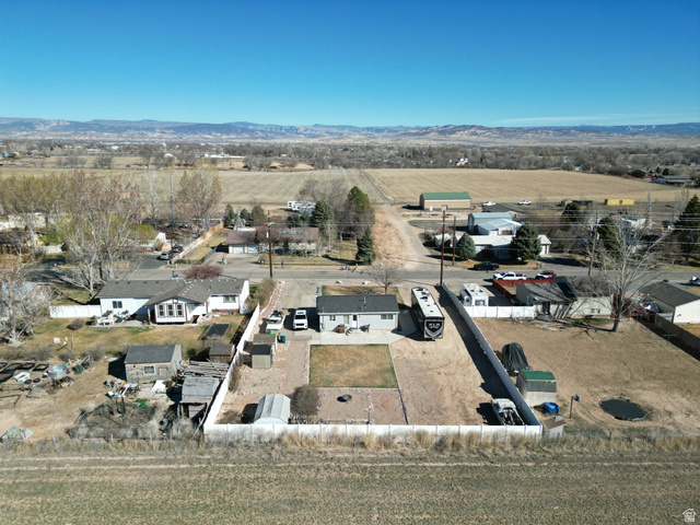 1852 East 3500th Street South Vernal, UT 84078 - Photo 35 of 46 View of rural area featuring nearby suburban area and a mountain backdrop-looking north