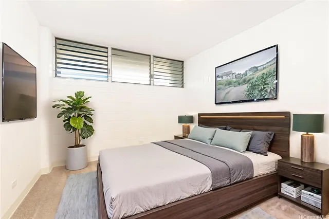 a bedroom with a bed and a painting on the wall