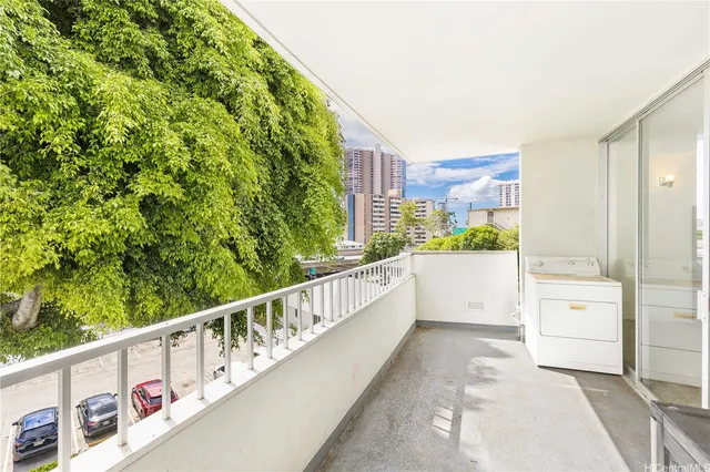 a view of balcony with a yard