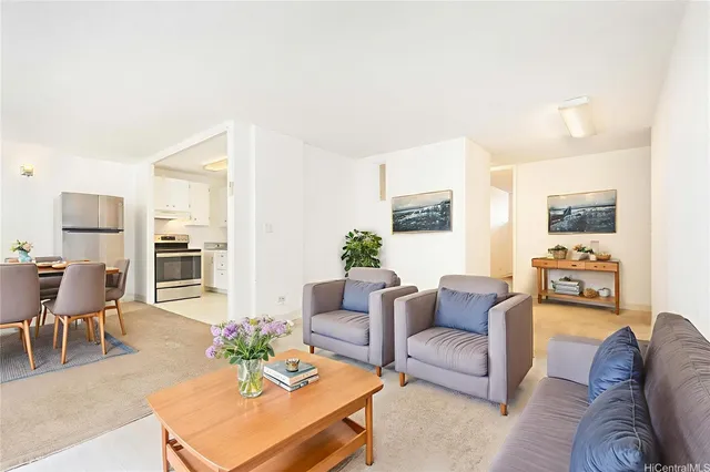 a living room with furniture dining table and a couch