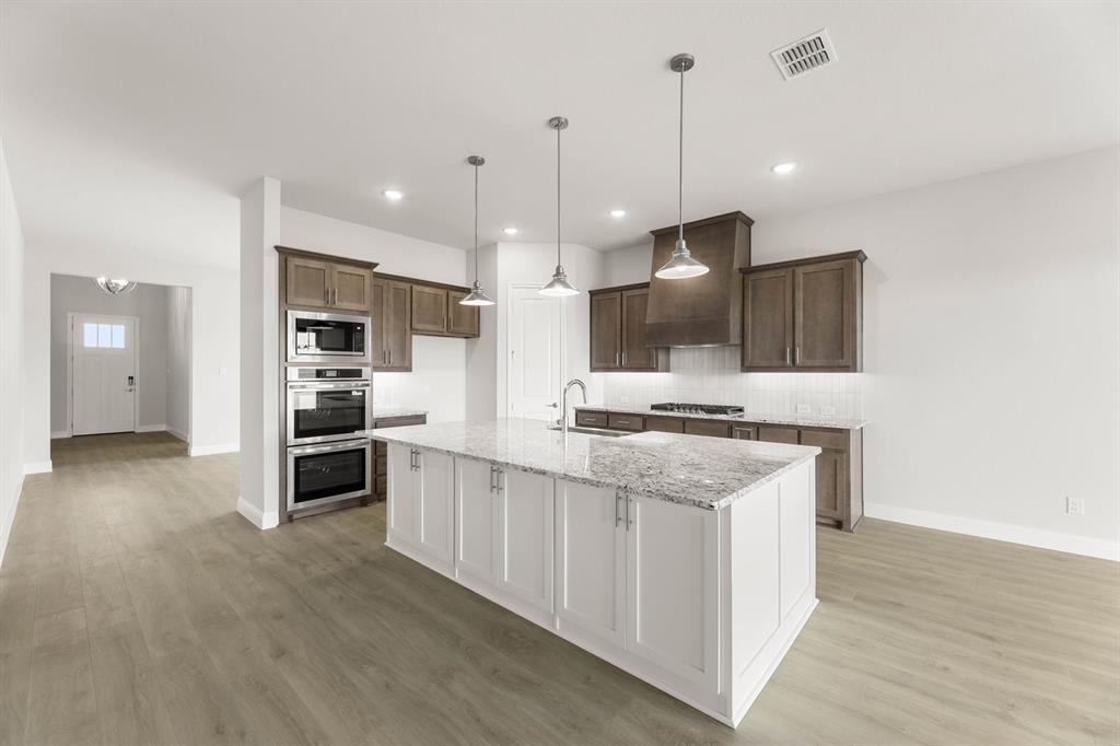132 Evanston Court Rhome, TX 76078 - Photo 15 of 40 132 Evanston-Kitchen-2