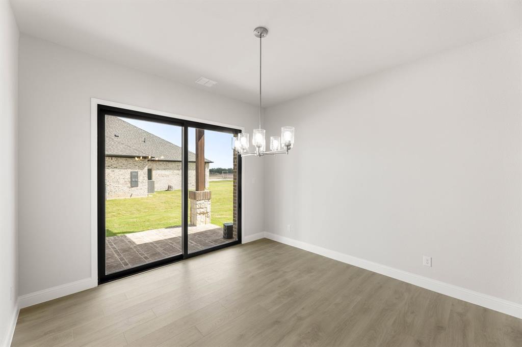 132 Evanston Court Rhome, TX 76078 - Photo 9 of 40 132 Evanston-Dining Room-1