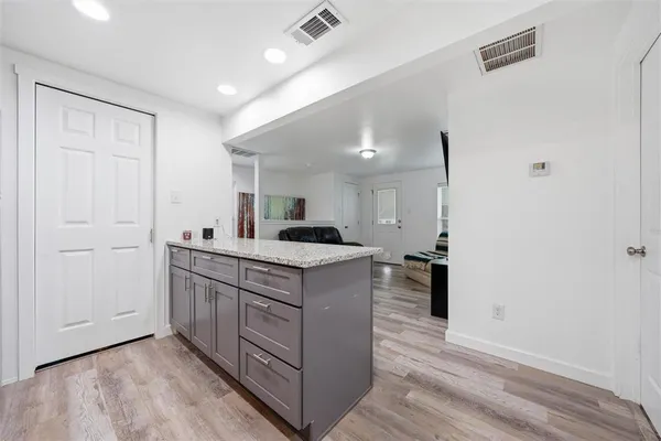 a kitchen with stainless steel appliances granite countertop a stove and a sink