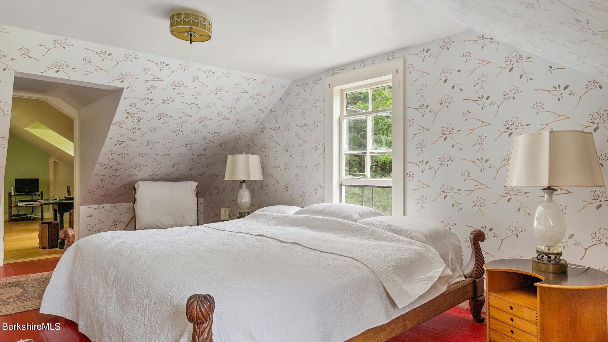 601 East River Road Chester, MA 01050 - Photo 23 of 49 a bedroom with a bed and a window