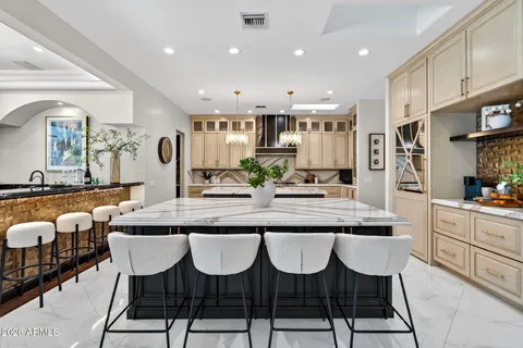 a kitchen with stove and cabinets