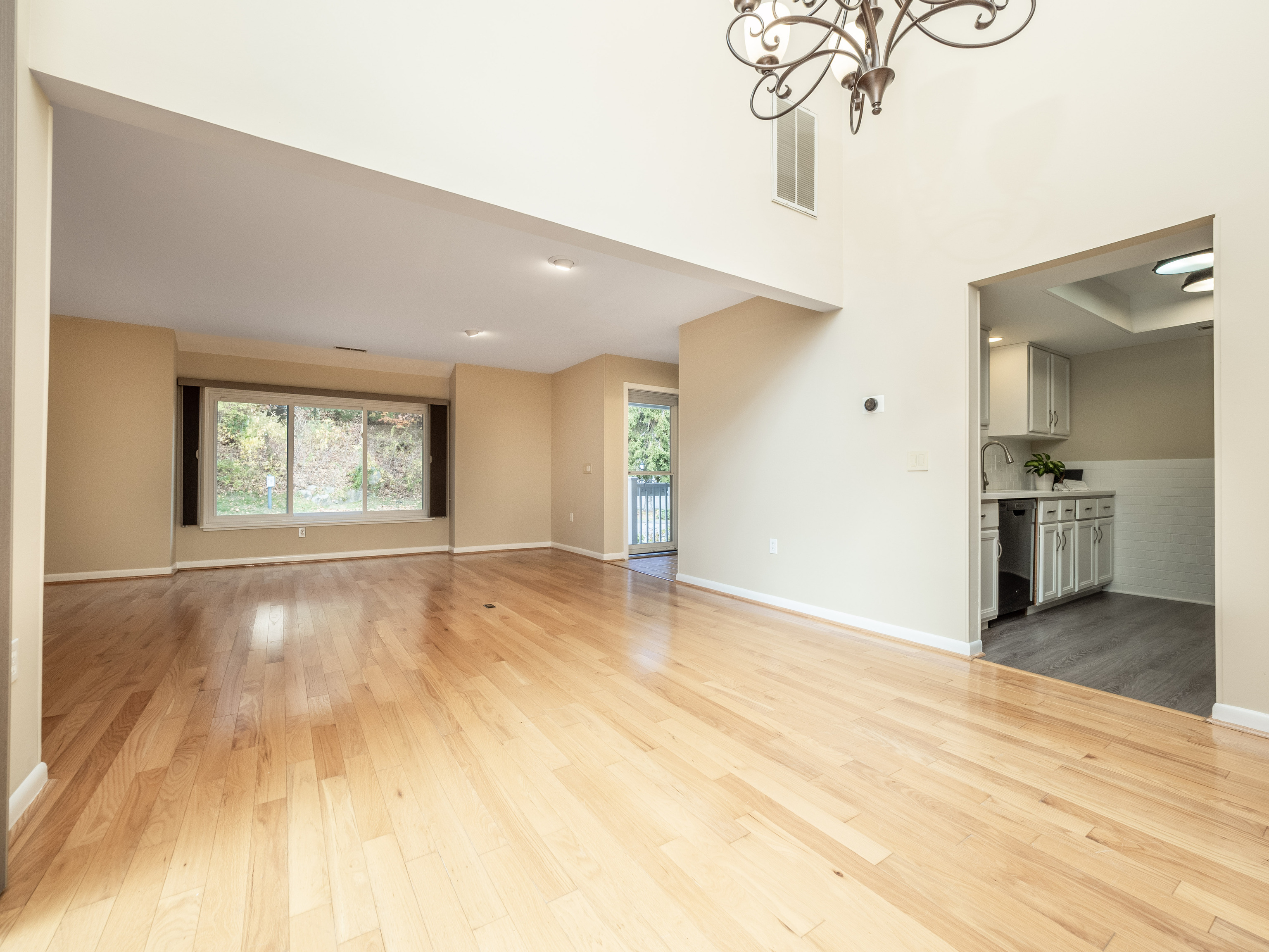 52 Glen Ridge, Unit 52 Wilton, CT 06897 - Photo 11 of 27 a view of an empty room with wooden floor and a window
