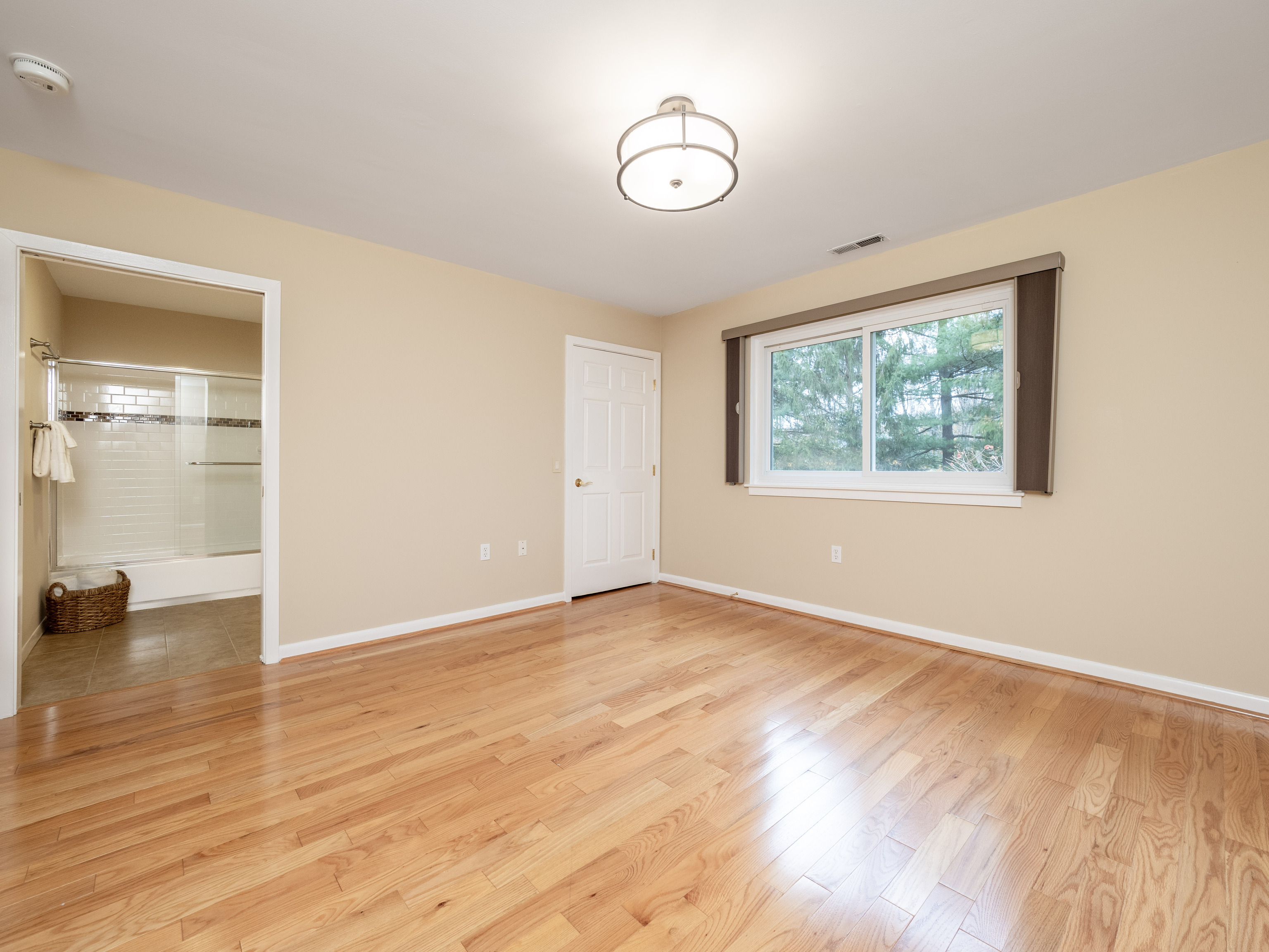 52 Glen Ridge, Unit 52 Wilton, CT 06897 - Photo 16 of 27 an empty room with wooden floor and windows