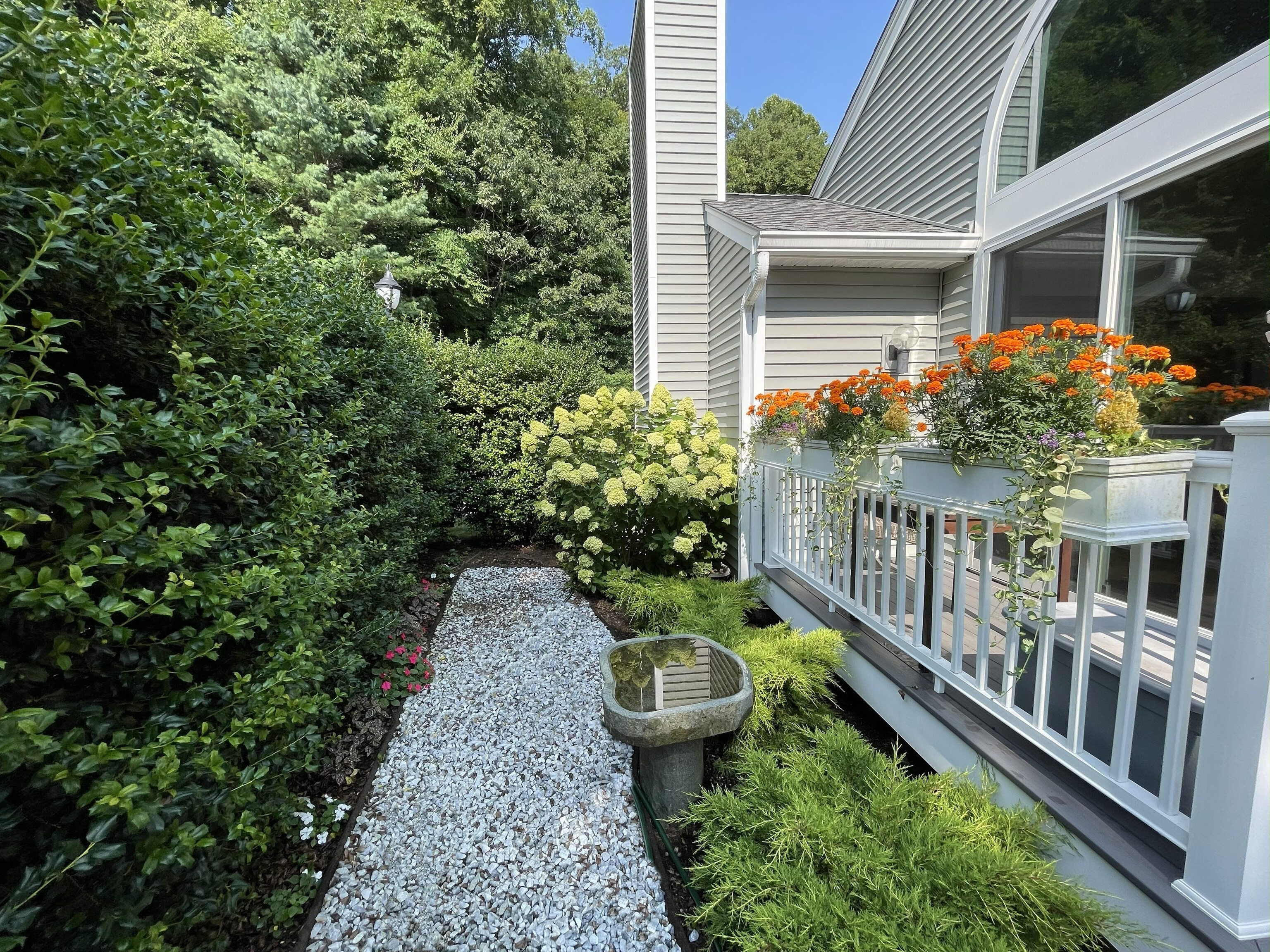 52 Glen Ridge, Unit 52 Wilton, CT 06897 - Photo 5 of 27 a front view of a house with potted plants