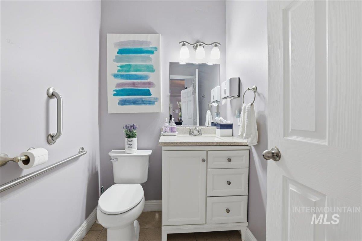 7501 West Swift Lane Boise, ID 83704 - Photo 16 of 50 Half bathroom featuring vanity and tile patterned floors