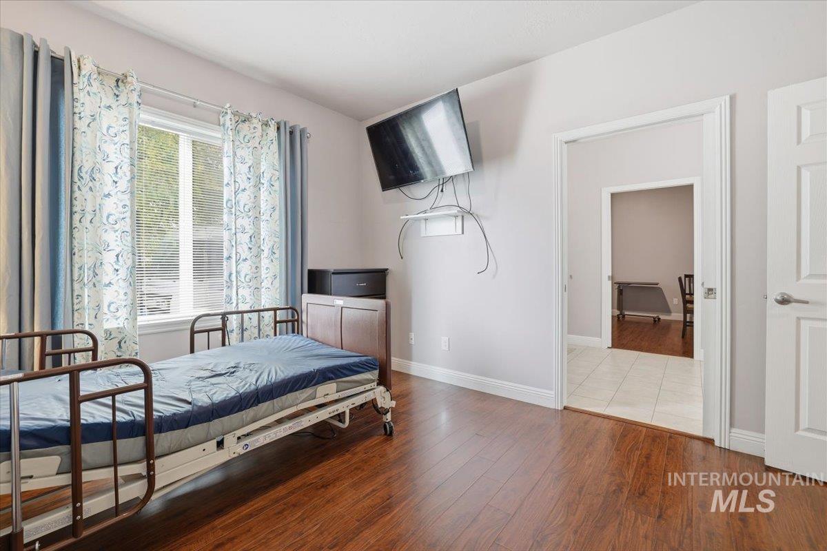 7501 West Swift Lane Boise, ID 83704 - Photo 33 of 50 Bedroom featuring wood finished floors and baseboards