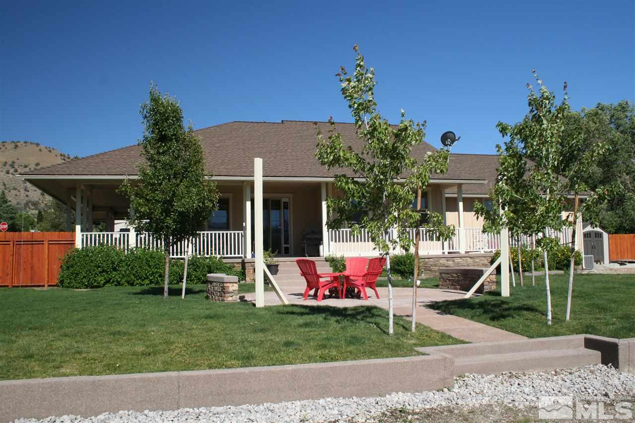 14455 Rancheros Drive Reno, NV 89521 - Photo 1 of 1 a backyard of a house with table and chairs