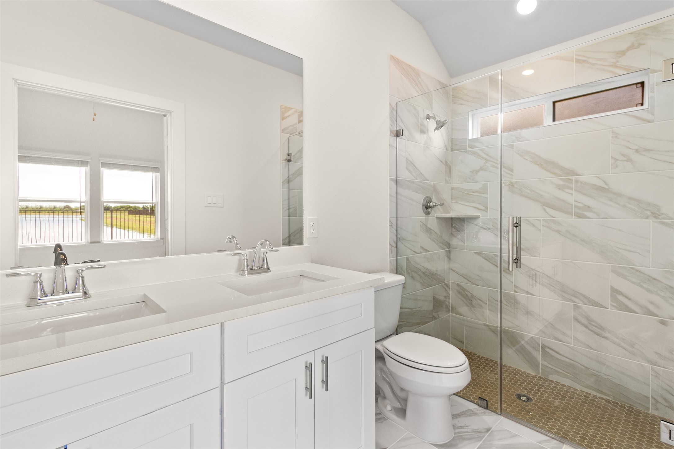 6643 Escondido Drive Rosharon, TX 77583 - Photo 13 of 25 a bathroom with a sink toilet and shower