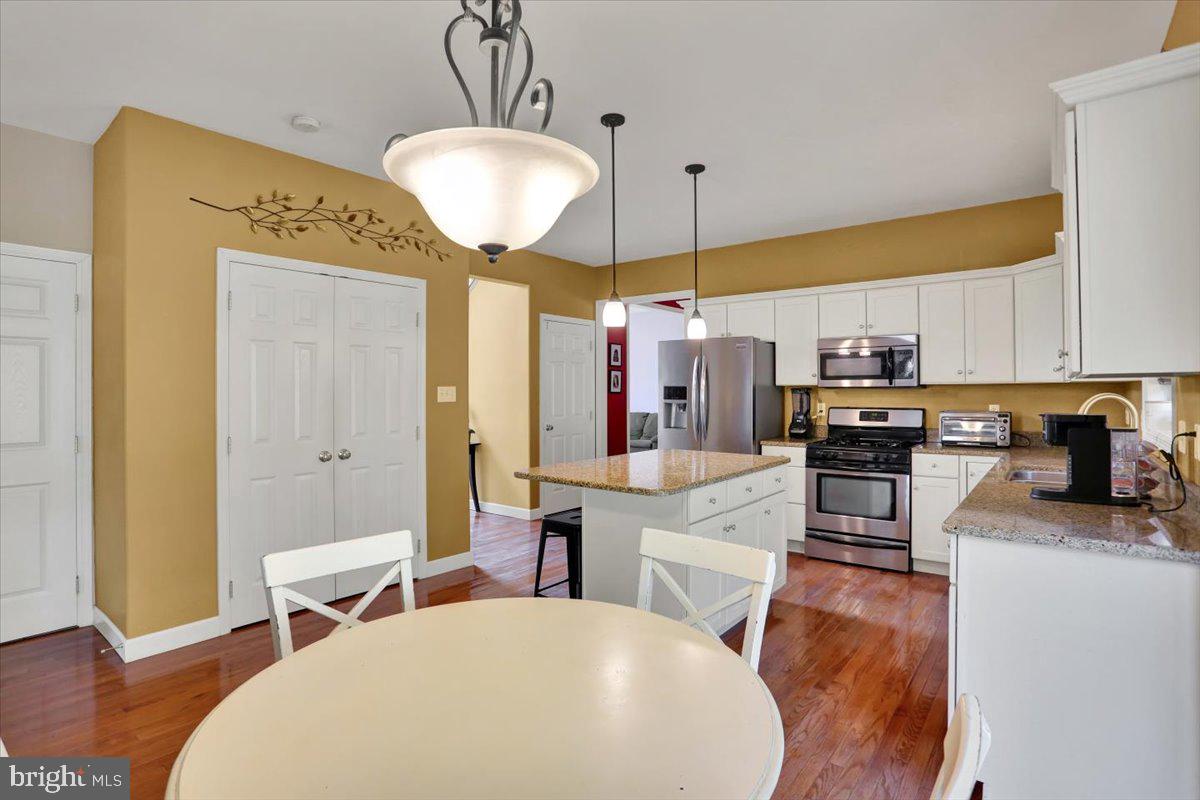 21 Sawgrass Drive Reading, PA 19606 - Photo 11 of 51 a large kitchen with a table and chairs