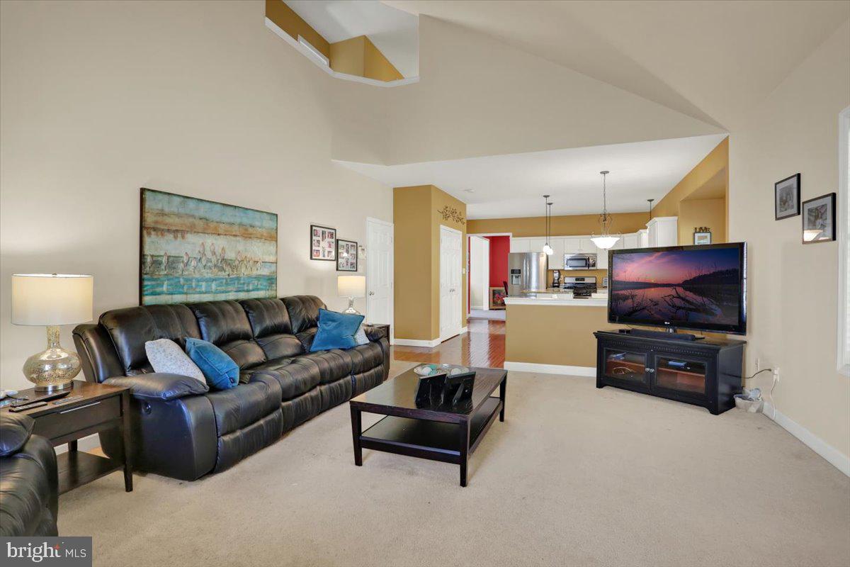 21 Sawgrass Drive Reading, PA 19606 - Photo 16 of 51 a living room with furniture and a flat screen tv