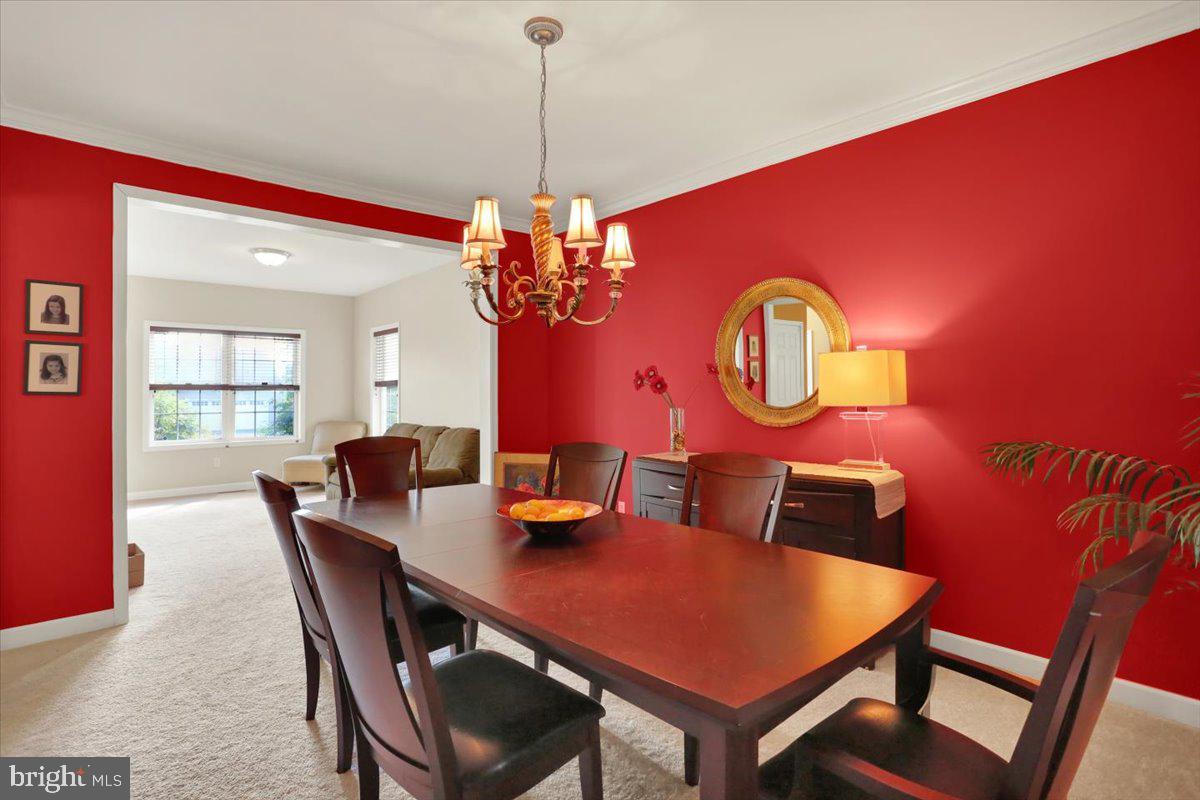 21 Sawgrass Drive Reading, PA 19606 - Photo 18 of 51 a view of a dining room with furniture and a chandelier