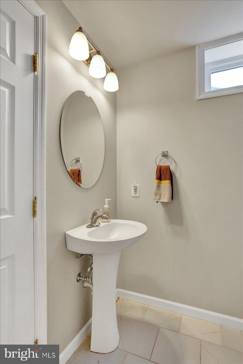 21 Sawgrass Drive Reading, PA 19606 - Photo 28 of 51 a bathroom with a sink and a mirror