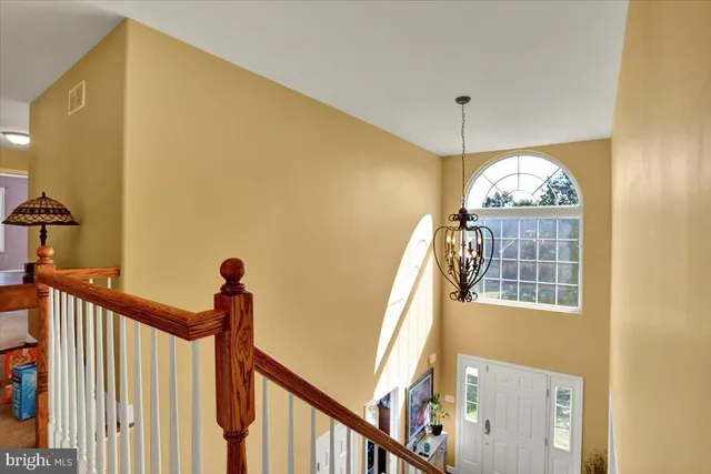a view of living room with furniture and a fireplace
