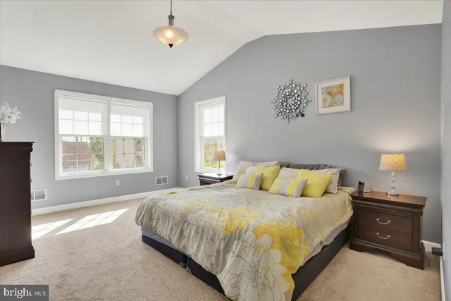 a bedroom with a bed and a television