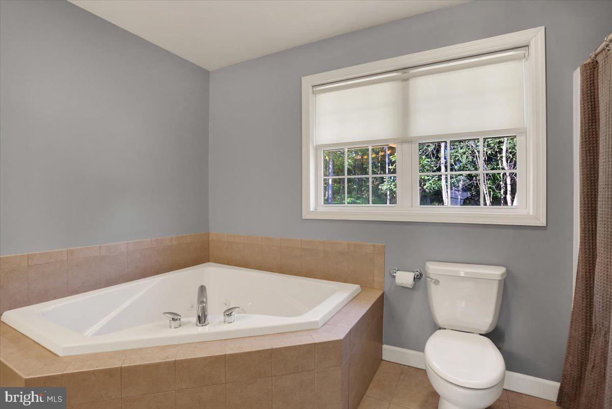 21 Sawgrass Drive Reading, PA 19606 - Photo 43 of 51 a white bath tub sitting next to a toilet