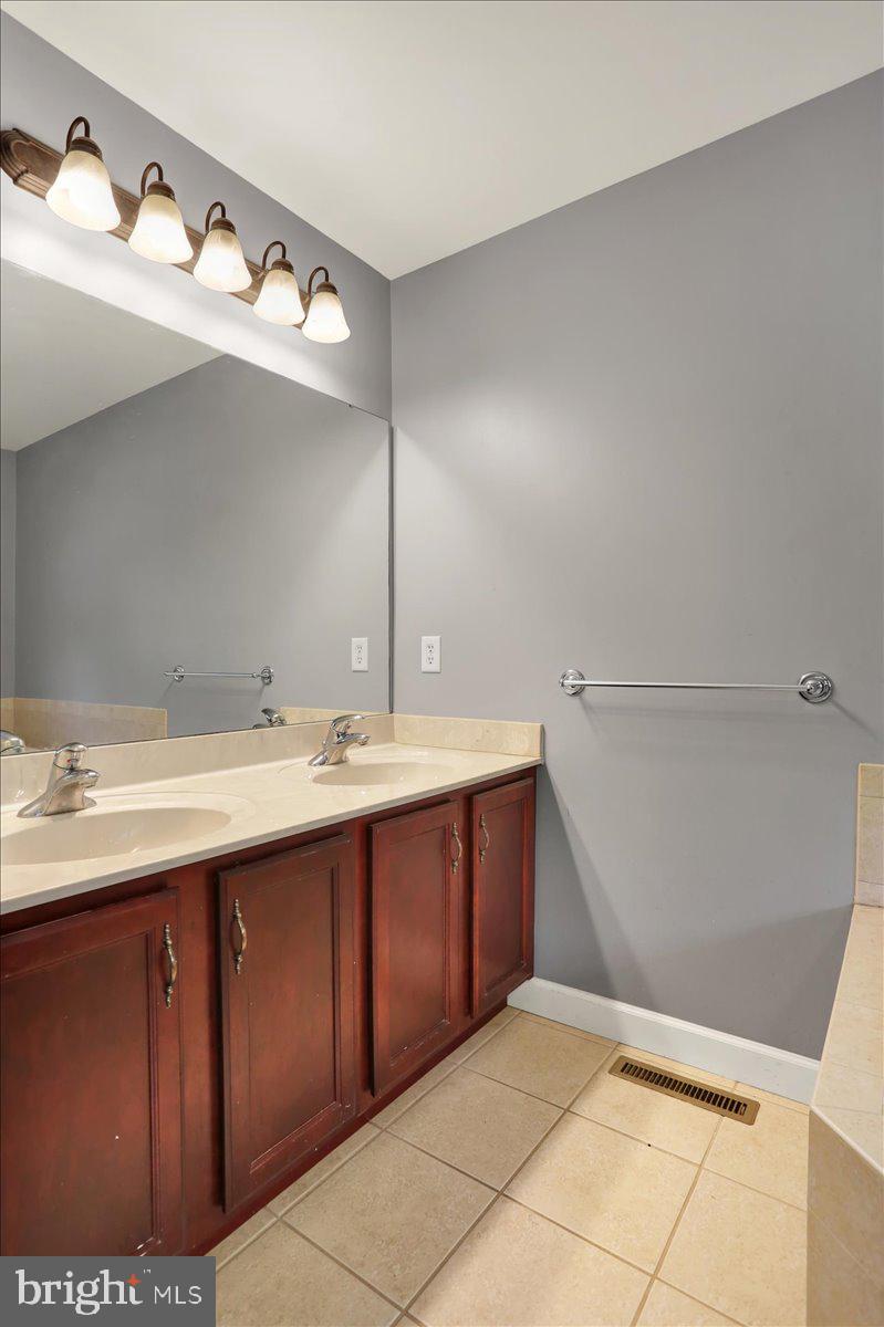 21 Sawgrass Drive Reading, PA 19606 - Photo 45 of 51 a bathroom with a sink and mirror