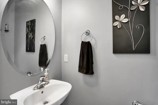 a bathroom with a sink and mirror