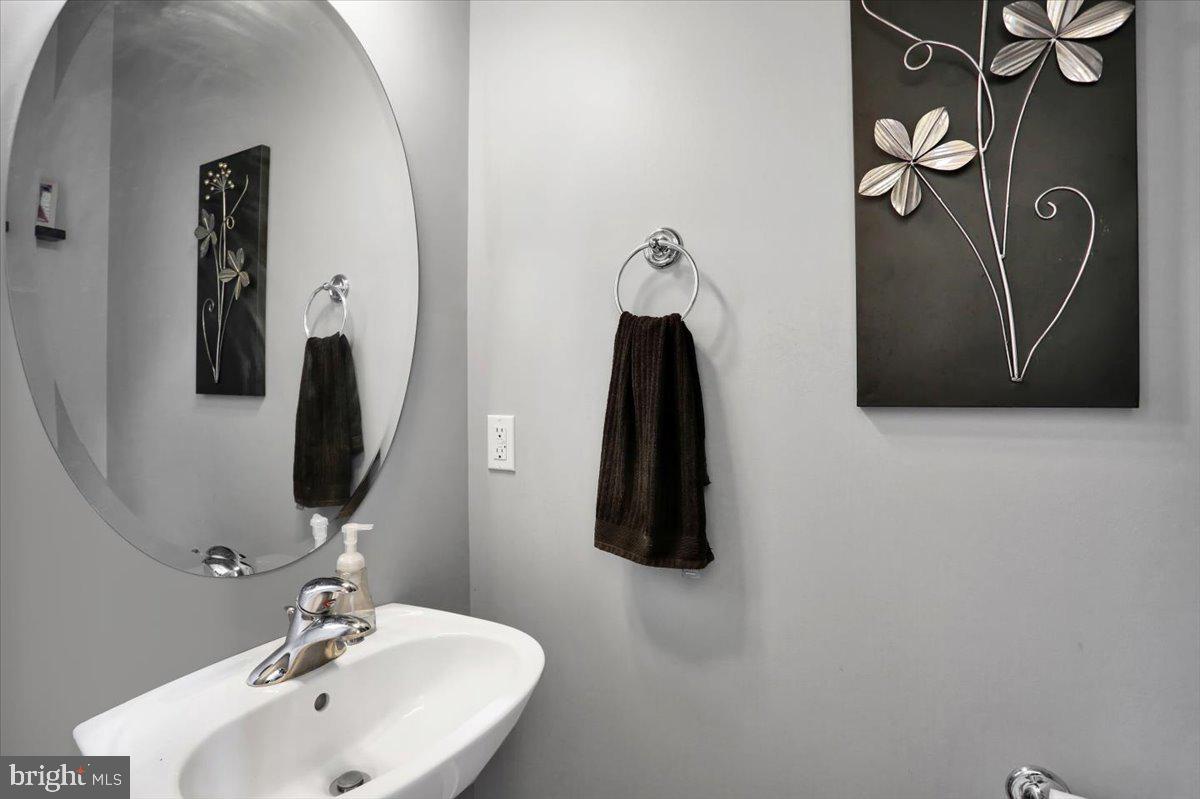 21 Sawgrass Drive Reading, PA 19606 - Photo 5 of 51 a bathroom with a sink and mirror