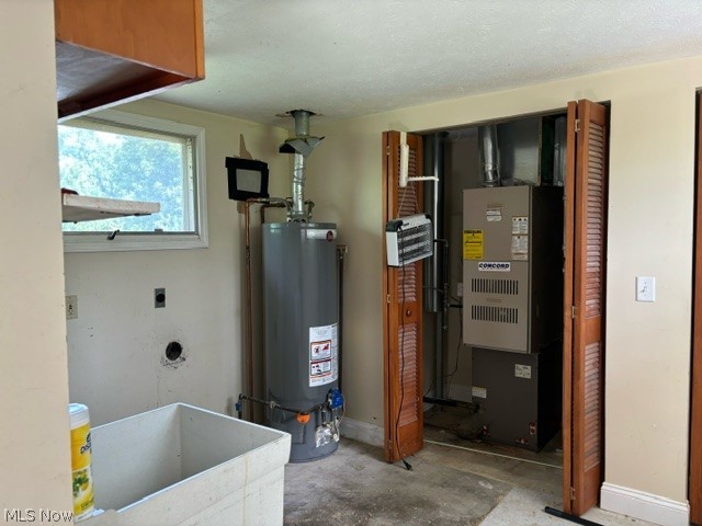 8526 Fosdick Road Cleveland, OH 44125 - Photo 10 of 25 Utilities with heating unit, sink, and water heater