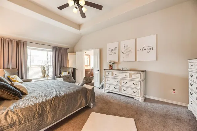 a bedroom with a bed a window and closet