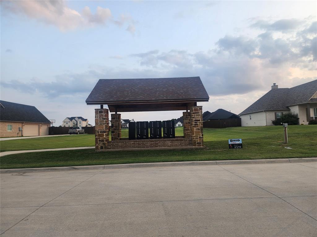 124 Chisolm Trail Pottsboro, TX 75076 - Photo 13 of 15 View of community with mail area and a yard