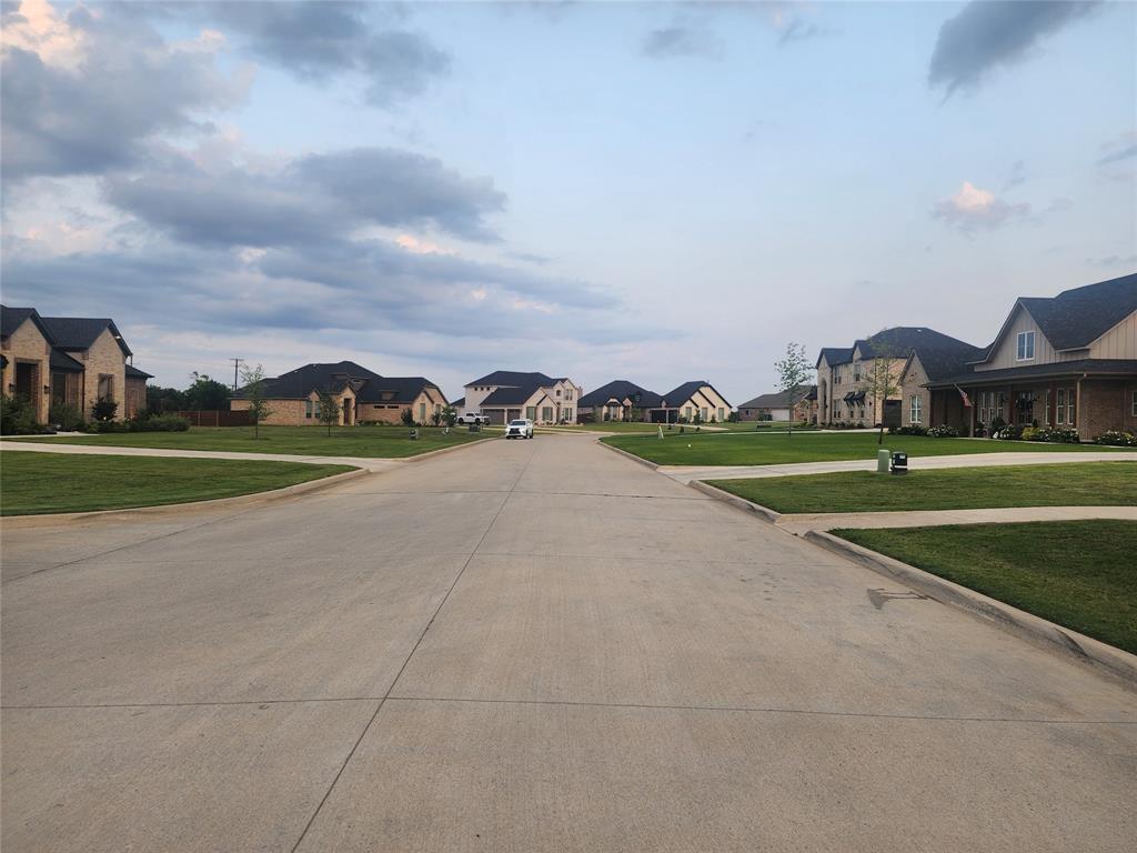 124 Chisolm Trail Pottsboro, TX 75076 - Photo 15 of 15 View of concrete road with a residential view and curbs
