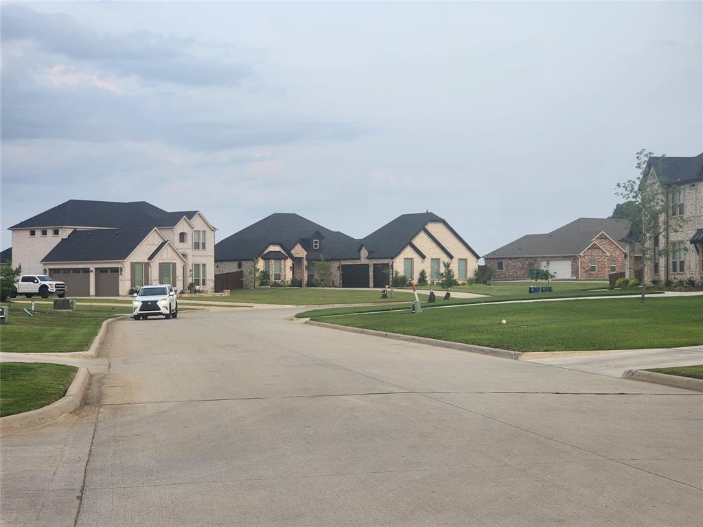 124 Chisolm Trail Pottsboro, TX 75076 - Photo 10 of 15 View of concrete street featuring curbs and a residential view