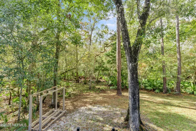 a bathroom with a sink and mirror with toilet