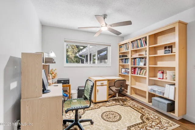 a view of a lake with a house in the background