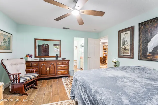a aerial view of a house with a yard and outdoor space