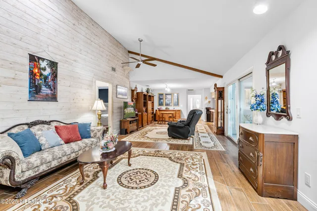 a view of a yard with wooden fence